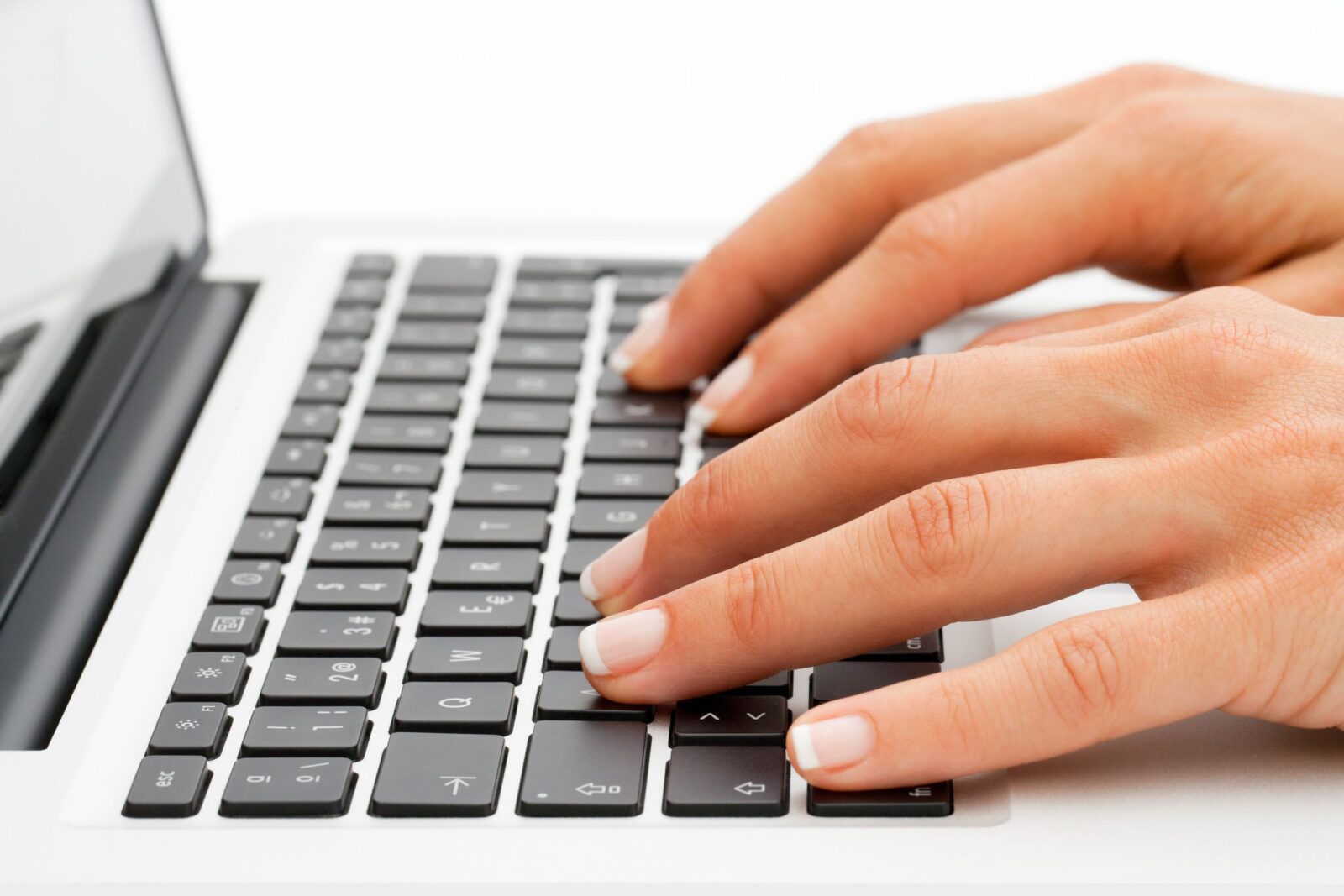 Hands Typing on Laptop Keyboard