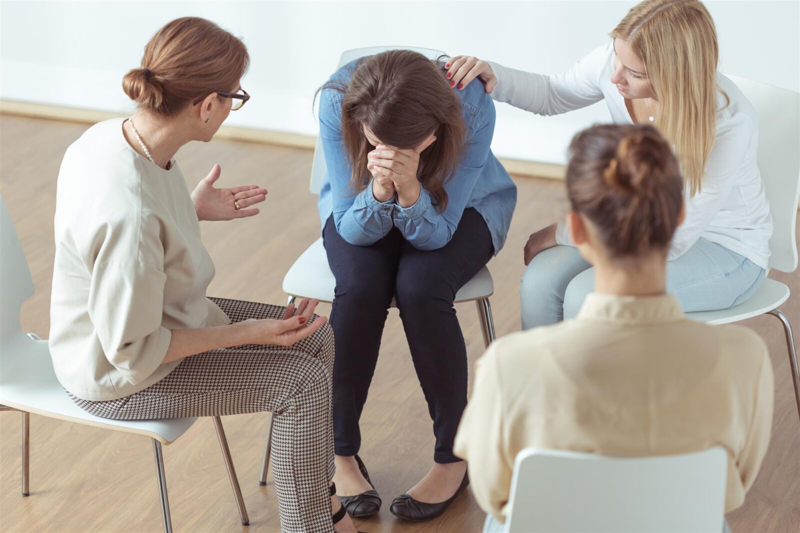 young woman crying during group therapy
